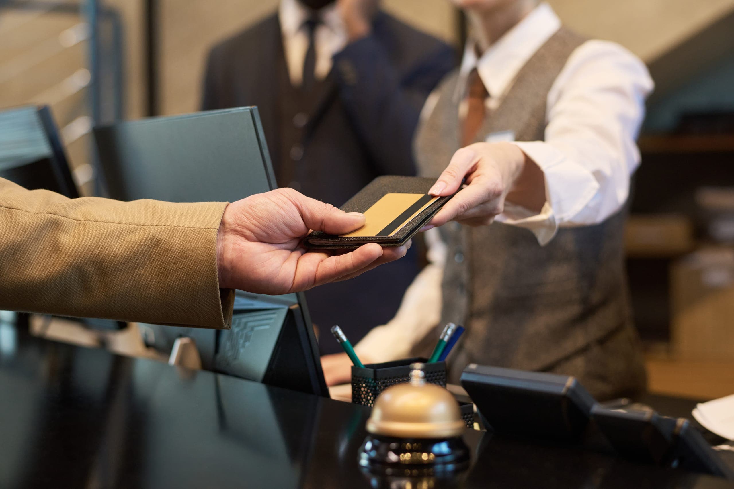 Guest providing a card for hotel credit card processing