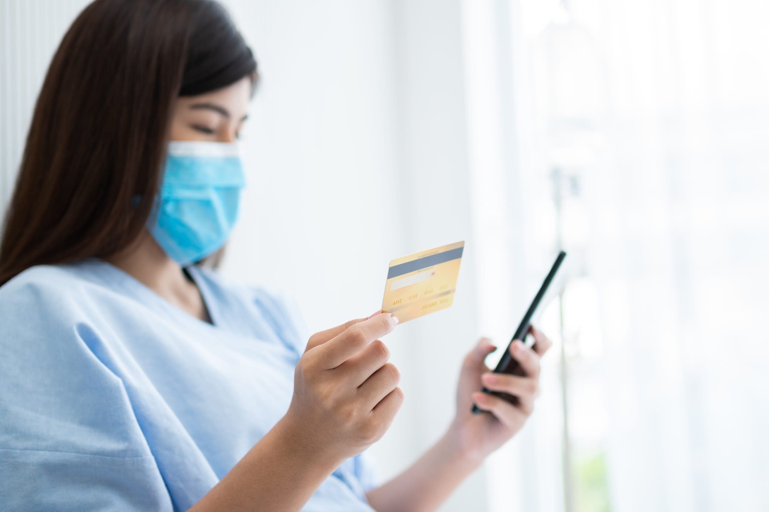 Nurse using healthcare merchant services